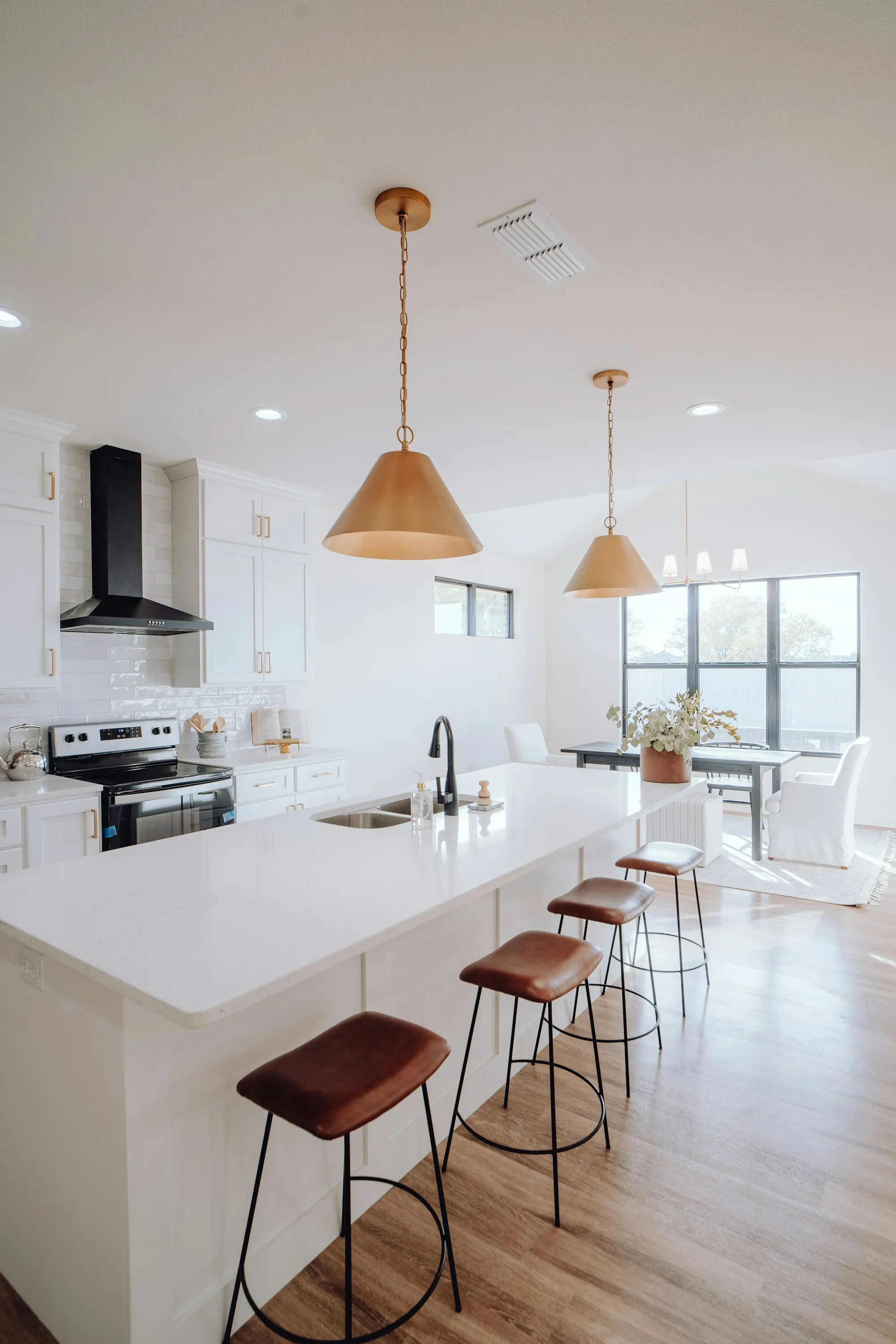 Notebook with a room sketch and a list of remodeling costs on a kitchen table