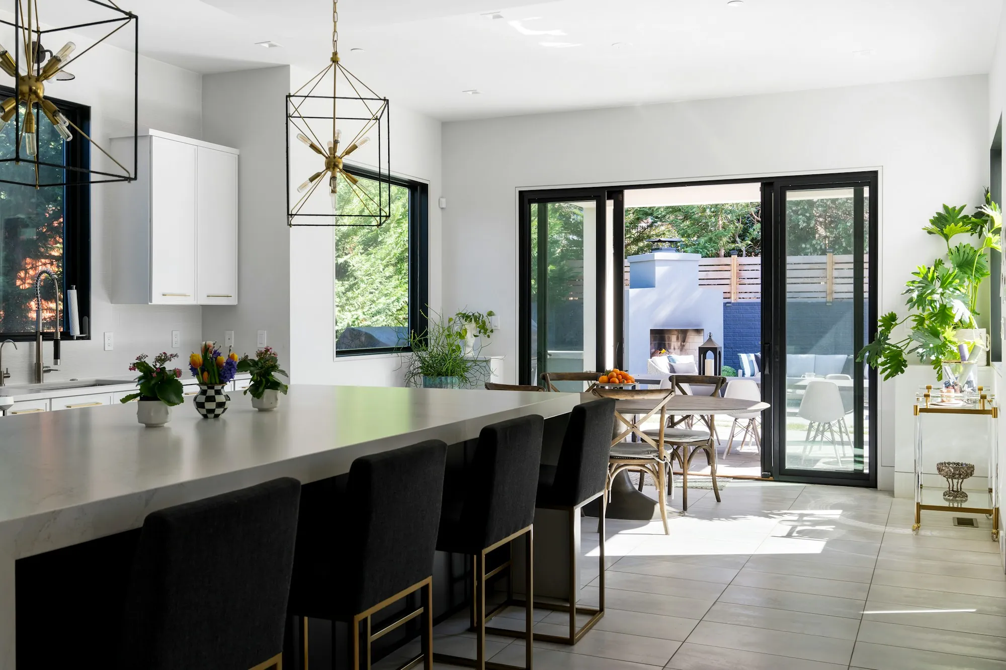 Homeowner reviewing a written change order with a contractor in a half-finished kitchen