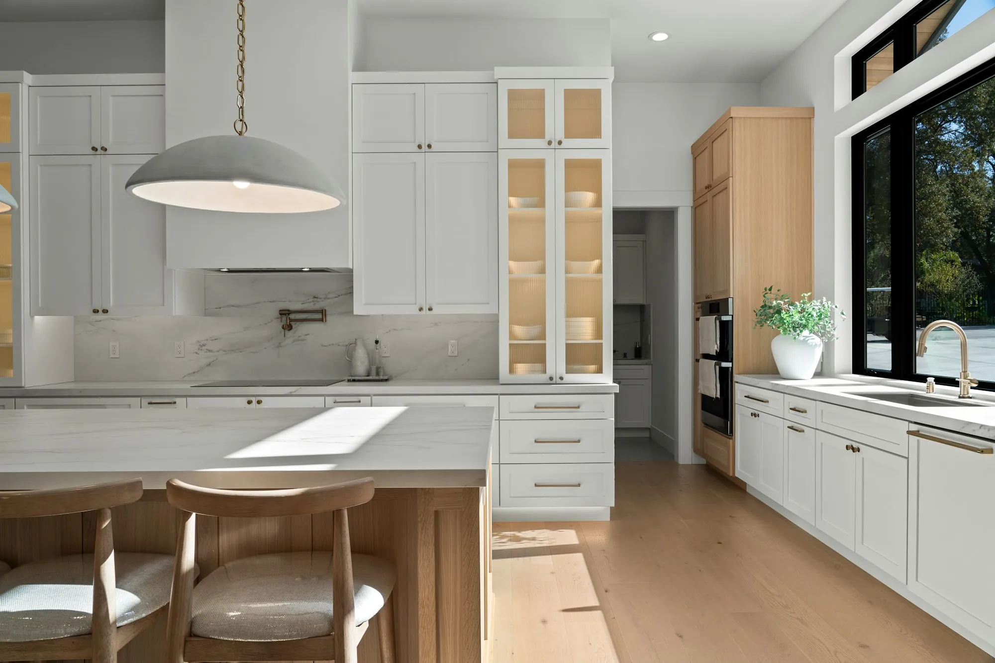 Bright remodeled bathroom with a walk-in shower and a floating vanity